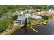 Waterfront property featuring a spacious backyard, screened enclosure, and private dock on tranquil waters at 5771 Catskill Rd, Holiday, FL 34690