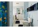 Kid-friendly bathroom featuring marine themed decorations, a bathtub, and blue accents at 5771 Catskill Rd, Holiday, FL 34690