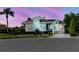 Charming home with blue exterior, a welcoming porch and well-maintained landscaping enhancing its curb appeal at 5771 Catskill Rd, Holiday, FL 34690