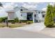 Attractive home featuring a well-manicured lawn, colorful landscaping, and inviting curb appeal at 5771 Catskill Rd, Holiday, FL 34690