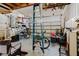 Spacious garage featuring a ladder, bicycle, and ample storage space at 5771 Catskill Rd, Holiday, FL 34690