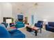 Open living room featuring tile floors, ample seating, and access to other rooms at 5771 Catskill Rd, Holiday, FL 34690