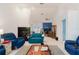 Bright living room showcasing an open layout with tile floors and comfortable furnishings at 5771 Catskill Rd, Holiday, FL 34690