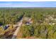 Overhead shot of the home nestled amongst a dense forest, offering privacy and a serene setting at 7482 Winter St, Brooksville, FL 34613