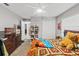 This bedroom includes a closet, TV, dresser, shelves, and a large comfortable bed at 7482 Winter St, Brooksville, FL 34613