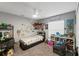 Comfortable bedroom featuring a ceiling fan, closet, window, and carpet flooring at 7482 Winter St, Brooksville, FL 34613