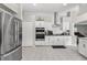 Bright kitchen boasts white cabinets, stainless steel appliances, and a convenient double oven at 7482 Winter St, Brooksville, FL 34613