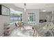 Bright kitchen featuring granite countertops, modern lighting, and a breakfast nook overlooking the pool at 7482 Winter St, Brooksville, FL 34613
