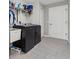 Efficient laundry room with modern washer and dryer, ample storage shelves, and streamlined design for convenience at 7482 Winter St, Brooksville, FL 34613