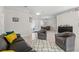 Cozy living room featuring light tile flooring and neutral colored paint at 7482 Winter St, Brooksville, FL 34613
