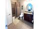 Cozy bathroom with a vanity, granite countertop, and shower-tub combo at 1421 Apollo Beach Blvd, Apollo Beach, FL 33572
