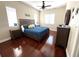 A serene bedroom with hardwood floors, a ceiling fan, and plenty of natural light at 1421 Apollo Beach Blvd, Apollo Beach, FL 33572