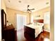 Cozy bedroom with natural light, hardwood floors, ceiling fan and neutral decor at 1421 Apollo Beach Blvd, Apollo Beach, FL 33572