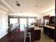 Open floor plan features a bar, dining area, and living room with floor to ceiling windows at 1421 Apollo Beach Blvd, Apollo Beach, FL 33572