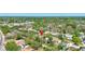 An aerial view of the neighborhood showcasing mature trees and nearby community at 1888 Douglas Ave, Dunedin, FL 34698