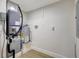 A utility room showing the HVAC, water heater, and electrical panel, with light flooring at 1888 Douglas Ave, Dunedin, FL 34698