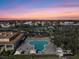 Aerial view of a community pool and recreation area at sunset at 2042 Australia W Way # 14, Clearwater, FL 33763