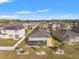 Aerial view of property with solar panels and screened-in lanai at 2109 Trillium Blvd, Brooksville, FL 34604