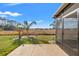 Enjoy this backyard view from the covered patio that features tropical plants and a big open space at 2109 Trillium Blvd, Brooksville, FL 34604