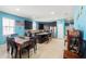 Spacious kitchen with a large island, stainless steel appliances, dark wood cabinets, and a dining area at 2109 Trillium Blvd, Brooksville, FL 34604