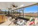 Relaxing screened-in lanai with seating and views of a large backyard at 2109 Trillium Blvd, Brooksville, FL 34604