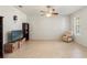 Spacious living room with ceiling fan, tile flooring, and natural light from the window at 2109 Trillium Blvd, Brooksville, FL 34604