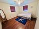 Comfortable bedroom with laminate floors and ample natural light at 3523 Cambridge St, New Port Richey, FL 34652