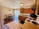 Bright kitchen with tile floors and dining area, perfect for casual meals at 3523 Cambridge St, New Port Richey, FL 34652