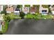 Aerial view of waterfront homes with a lake and well-maintained lawns showcases the desirable neighborhood at 3526 Overland Dr, Holiday, FL 34691