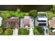 Aerial view of property showcasing the home, yard, pool and the surrounding neighborhood at 3526 Overland Dr, Holiday, FL 34691