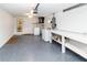 Spacious basement with washer, dryer, work bench and painted epoxy floor at 3526 Overland Dr, Holiday, FL 34691