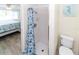 Bright bathroom featuring a tiled shower, modern fixtures, and beach-themed decor for a refreshing atmosphere at 3526 Overland Dr, Holiday, FL 34691