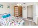 Bedroom featuring closet space, ensuite, and decor that brings light and brightness into the space at 3526 Overland Dr, Holiday, FL 34691