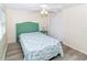 Relaxing bedroom featuring a ceiling fan and closet, creating a peaceful retreat at 3526 Overland Dr, Holiday, FL 34691