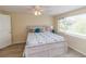 Well-lit bedroom with wood-look floors and calming decor at 3526 Overland Dr, Holiday, FL 34691