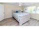 Bedroom featuring wood-look floors, window, and calming colors at 3526 Overland Dr, Holiday, FL 34691