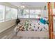 Bright bedroom with large windows offering scenic water views, creating a serene and inviting space at 3526 Overland Dr, Holiday, FL 34691