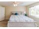 Well-lit bedroom with wood-look floors and calming decor at 3526 Overland Dr, Holiday, FL 34691