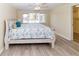 Cozy bedroom with wood-look floors and view of water at 3526 Overland Dr, Holiday, FL 34691