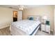 Bedroom featuring wood-look floors and access to the bathroom at 3526 Overland Dr, Holiday, FL 34691