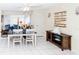 Bright dining room with a set table, large window, and coastal-themed decor at 3526 Overland Dr, Holiday, FL 34691