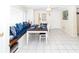 Well-lit dining area with built-in bench seating and coastal decor at 3526 Overland Dr, Holiday, FL 34691