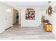 Inviting foyer with tile floors, decorative art, and open doorways leading to other rooms at 3526 Overland Dr, Holiday, FL 34691
