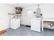 Well-lit laundry area in basement with modern washer and dryer at 3526 Overland Dr, Holiday, FL 34691