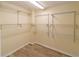Spacious walk-in closet with organized shelving, providing ample storage space at 3526 Overland Dr, Holiday, FL 34691