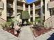 Multi-story condo building featuring well-maintained landscaping and assigned parking spaces at 4529 Whitton Way # 214, New Port Richey, FL 34653