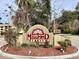 Community sign for Millpond Lakes with well maintained landscaping and shrubbery at 4529 Whitton Way # 214, New Port Richey, FL 34653