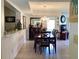 Traditional dining room with tile flooring and a chandelier at 4529 Whitton Way # 214, New Port Richey, FL 34653