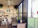 Lanai featuring patio table and chairs, shelving for plants and decor, and a nice view at 4529 Whitton Way # 214, New Port Richey, FL 34653