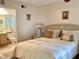 Main bedroom with neutral decor, accent lamps and ensuite bathroom at 4529 Whitton Way # 214, New Port Richey, FL 34653